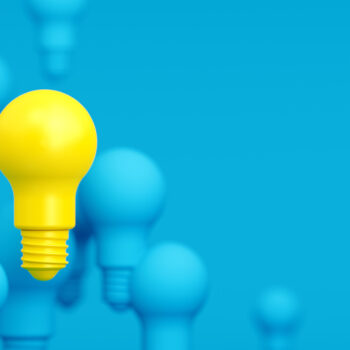 Blue and Yellow Light Bulbs over Blue Background